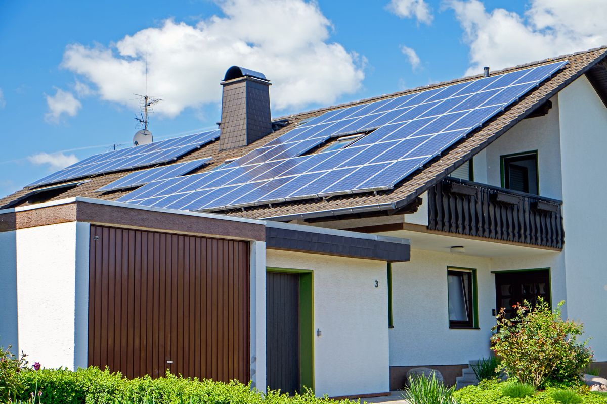 A house featuring solar panels installed on its roof, showcasing a commitment to renewable energy.